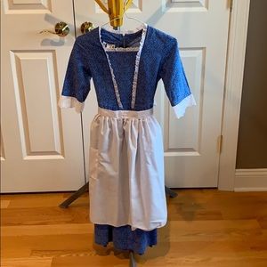 Girls colonial or pioneer costume in blue.
